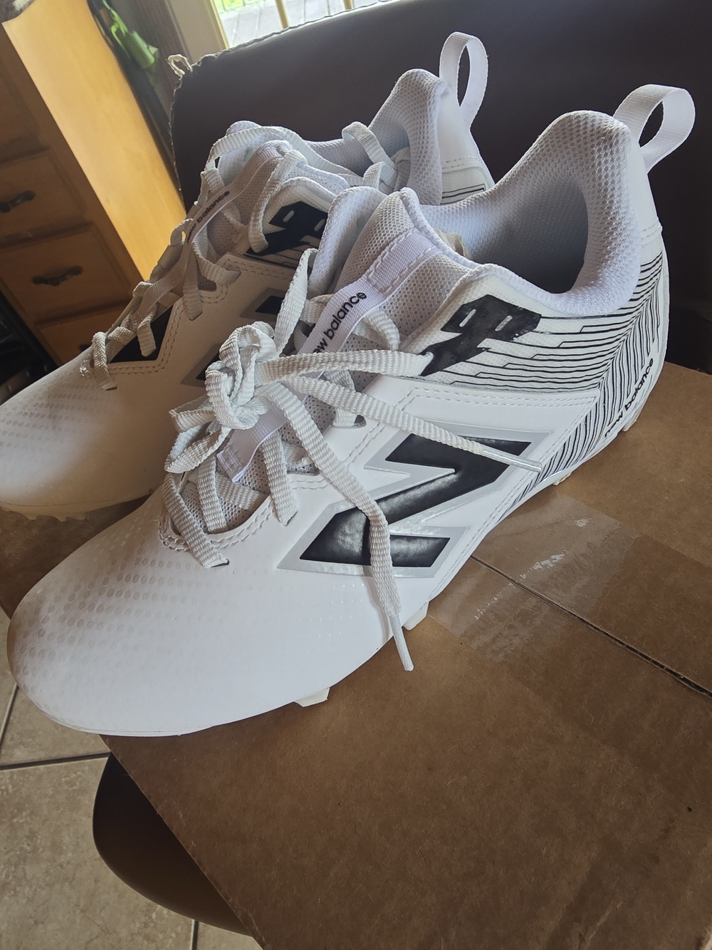 New Balance White and Black Men's Athletic Cleats